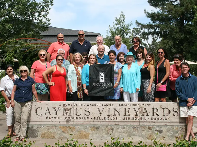 Group photo with Caymus Vineyard sign