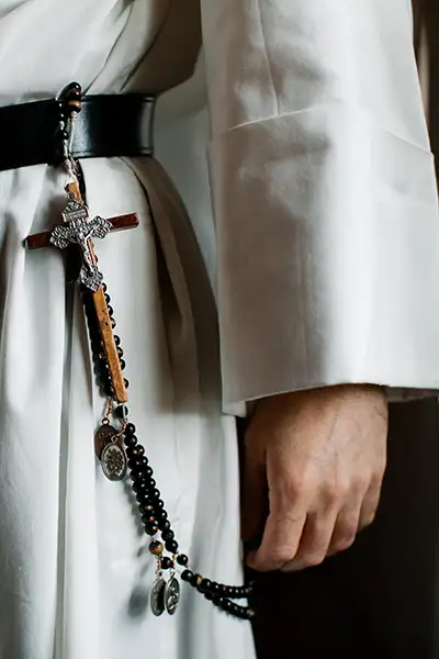 Cross hanging from a Friar's waist