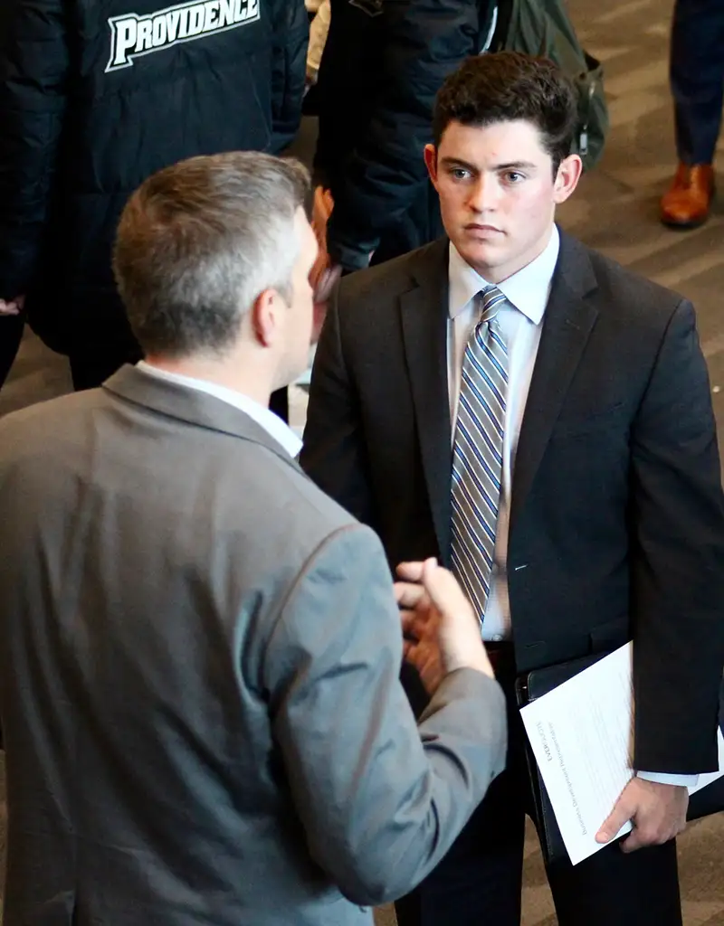people in suits talking