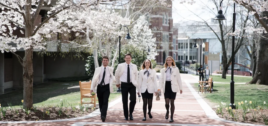 students walking on campus in the spring