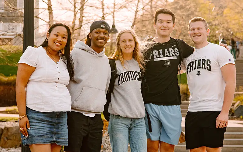 students in friar gear on campus