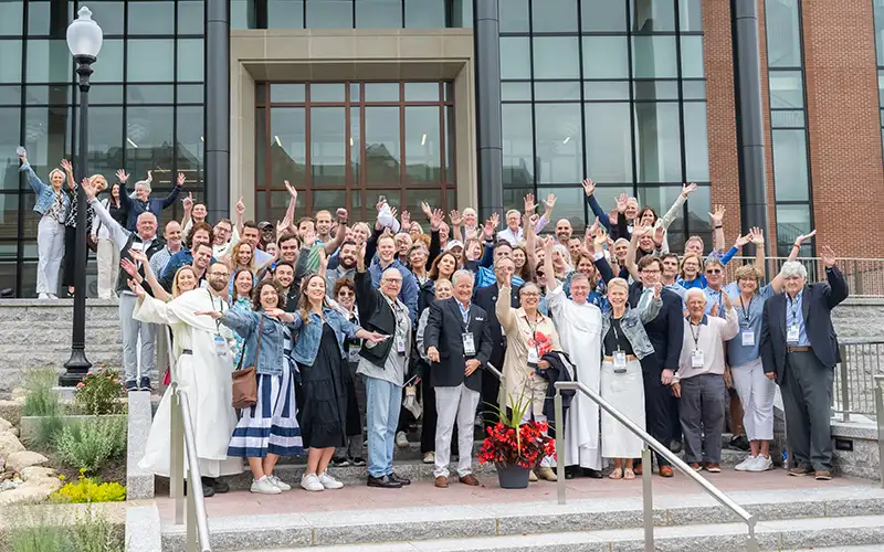 volunteers celebrating in front of the Ryan Center