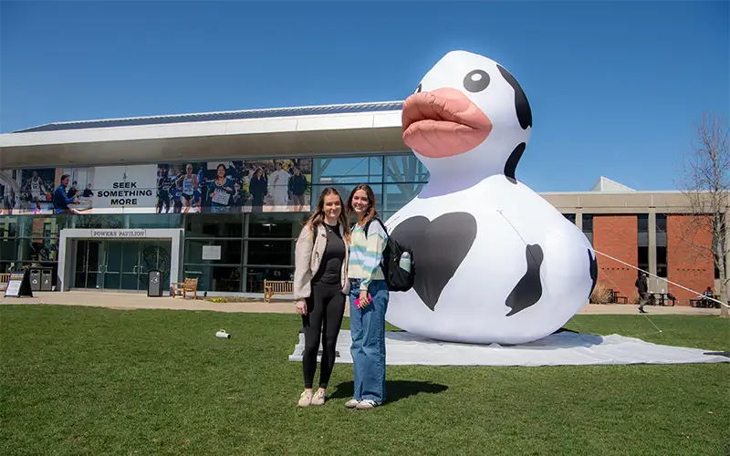 students with duck inflatable